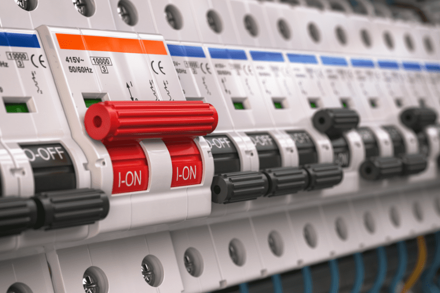 An electrical fuse box with the switches turned off for certain areas of a house.